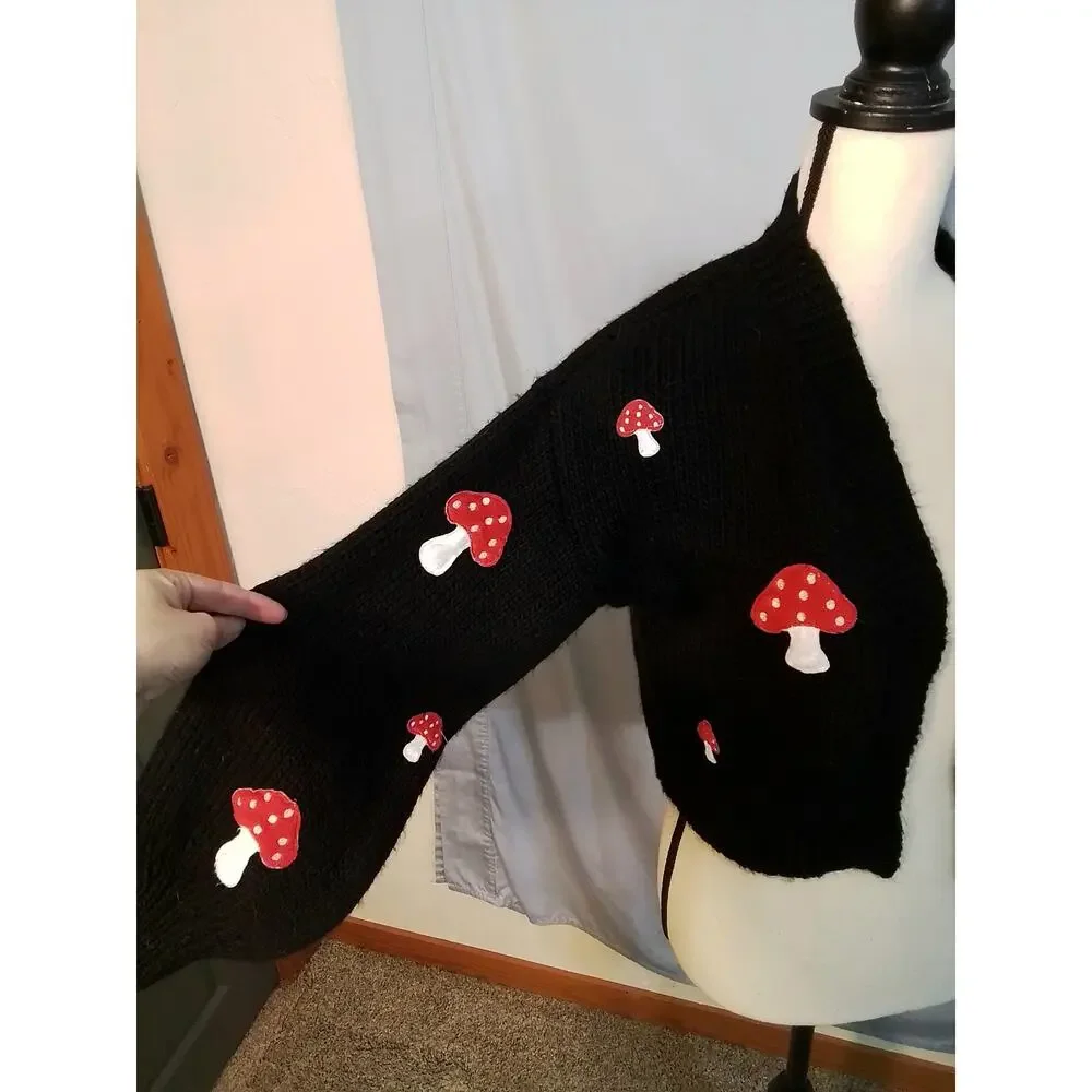 Forever 21 black sweater with red mushrooms.